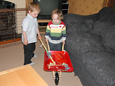 showing james his birthday wheelbarrow and garden tools